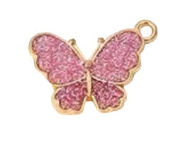 Rose colored butterfly with sparkles and gold plated back