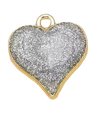 Silver sparkly heart with gold plated back