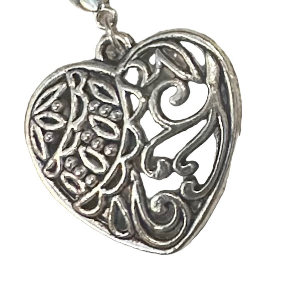 Silver desiring engraved heart